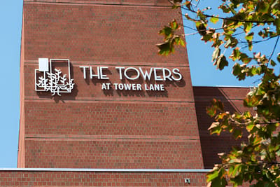 Building signage for The Towers at Tower Lane