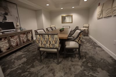 Common area with a meeting table and chairs