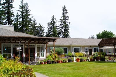 Outdoor space with greenery and resident rooms