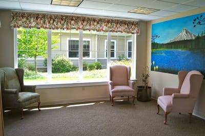 Cozy common area with a view of outdoor greenery
