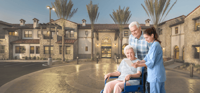 Care staff assisting a resident outside the facility