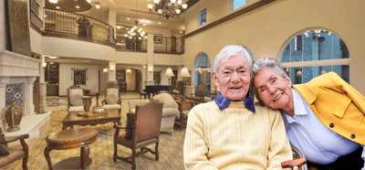 Couple smiling in a well-lit common area