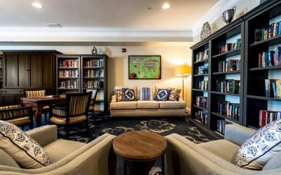 Cozy common area with bookshelves and seating