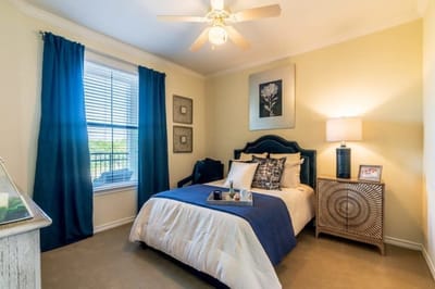 A cozy private resident room with bed and decor