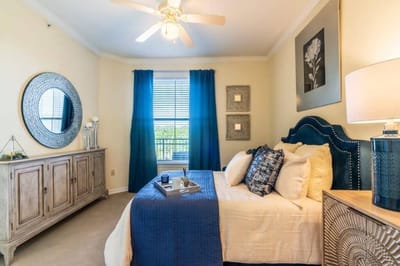 Well-furnished resident room with natural light