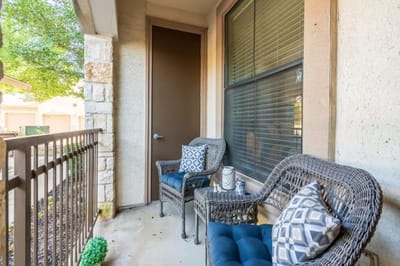 Outdoor seating area with chairs and door