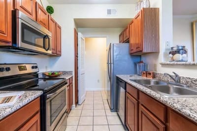 Interior view of a kitchen with wooden cabinets