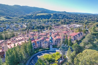 Aerial view of a senior living facility with landscaped grounds