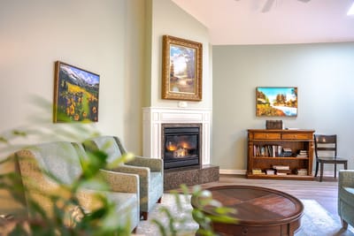 Bright common area with comfortable seating and artwork