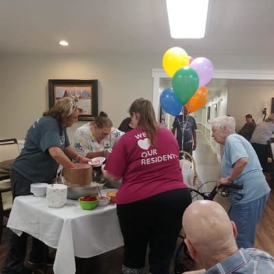 Staff serving food during a resident activity