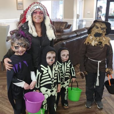 Residents and staff celebrating Halloween in the common area