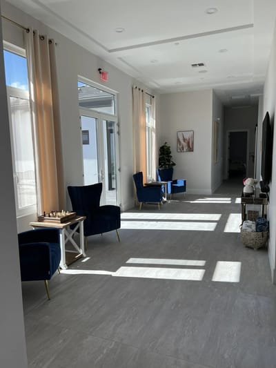 Bright common area with seating and sunlight