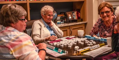 Residents playing a game in a common area