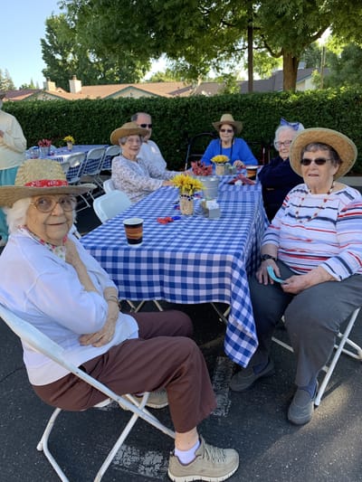 Residents enjoying an outdoor gathering at the facility