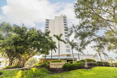Exterior view of Westminster Towers building surrounded by greenery