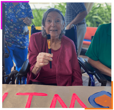 Resident painting during an arts activity
