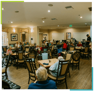 Residents dining in a common area of the facility