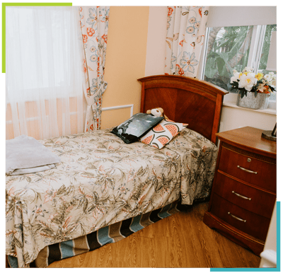 Cozy resident room with floral bedding and decor