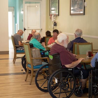 Residents enjoying a meal in the dining area