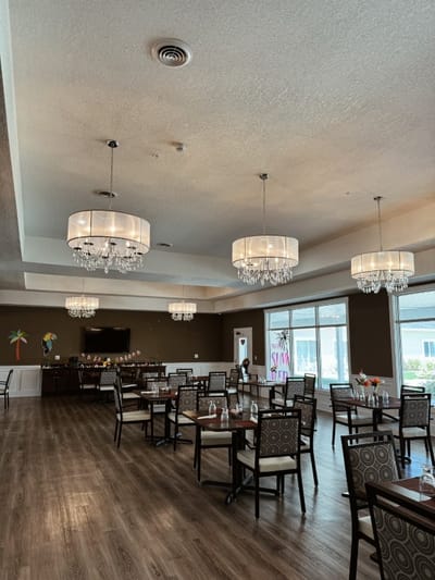 Elegant dining room with chandeliers and tables