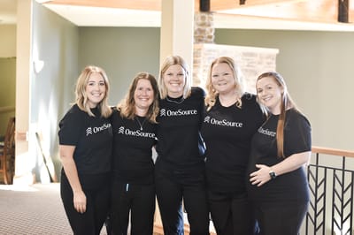 Staff members posing together in the common area