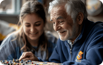 Residents enjoying a game together in a cozy setting