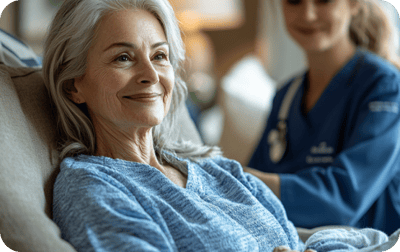 A senior resident smiling during a caregiving session