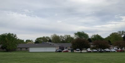 View of Orchard Park Assisted Living facility from the green lawn