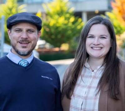Staff members smiling outdoors