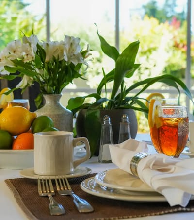 Dining table set with food and beverages