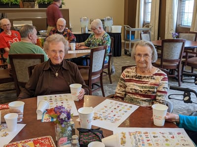 Residents enjoying a game activity in the common area
