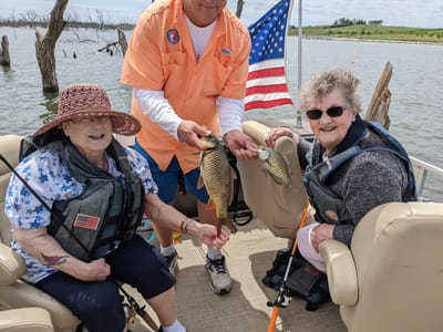 Residents enjoying a fishing trip on a boat