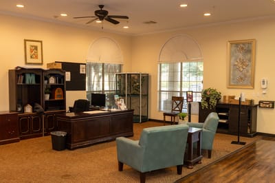 Reception area with a desk and seating