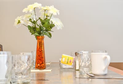 Dining table set with flowers and glasses