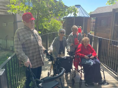 Residents enjoying an outdoor walkway.