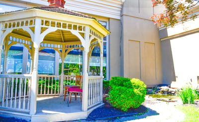 Gazebo in a garden area with greenery