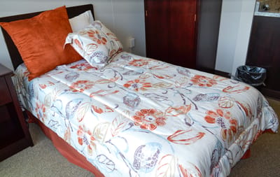 Cozy private room with floral bedding and decor