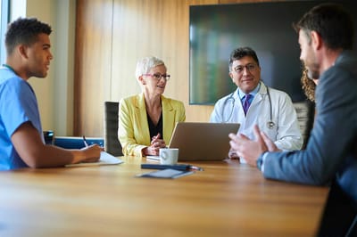 Medical staff and professionals in a meeting