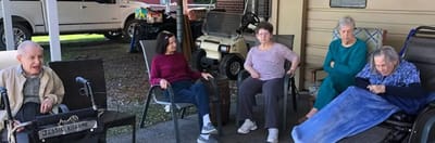 Residents enjoying time together outside.