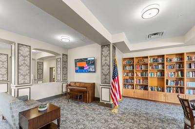 Common area with seating and bookshelves