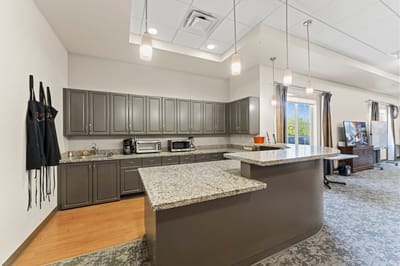 Interior kitchen area with granite countertops.