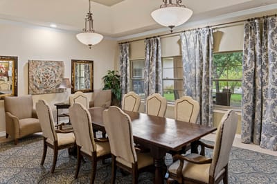 Elegant dining room with large wooden table and chairs
