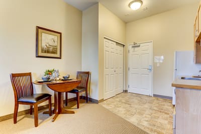 Cozy interior of a resident's room with dining area.