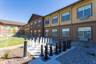 Outdoor chess area with building facade