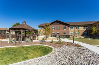 Exterior view of facility with gazebo and landscaping.