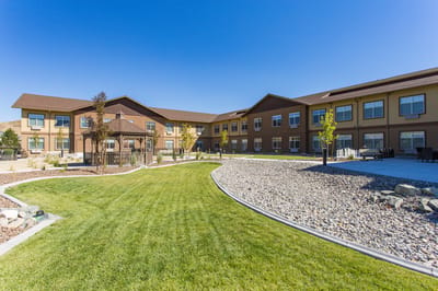 Exterior view of the facility with landscaped gardens