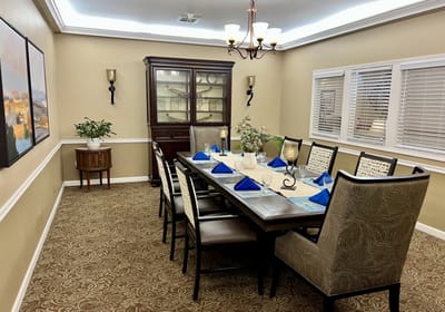Elegant dining room setup with blue napkins
