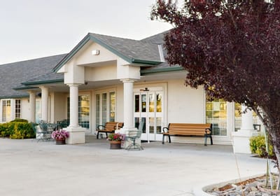 Exterior view of the facility entrance with benches