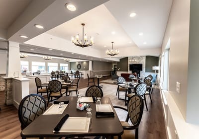 Modern dining area with tables and decor.
