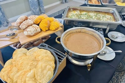 A variety of dishes and bread served at a meal.